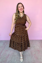 Load image into Gallery viewer, Girl in a brown polka dot midi dress with a pink backdrop