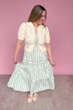 Load image into Gallery viewer, Woman wearing a vintage-style outfit with a pink background