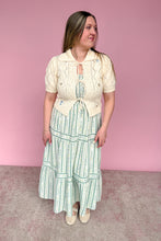 Load image into Gallery viewer, Woman wearing a vintage-style outfit with a pink background