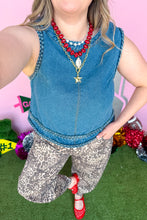 Load image into Gallery viewer, Girl wearing a denim braided tank with leopard barrel jeans standing in front of a pink game day backdrop.