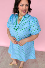 Load image into Gallery viewer, Woman wearing a light blue dress with green polka dots against a pink background