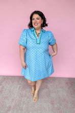 Load image into Gallery viewer, Woman wearing a blue dress with a pink background
