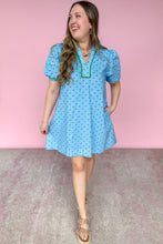 Load image into Gallery viewer, Woman wearing a light blue dress with green polka dots against a pink background