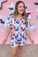 Load image into Gallery viewer, Woman wearing a patchwork outfit with a colorful star-patterned background