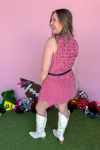 Load image into Gallery viewer, Girl wearing a red gingham romper with white boots in front of a pink game day backdrop.