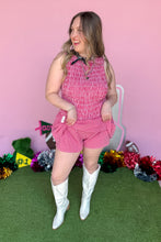 Load image into Gallery viewer, Girl wearing a red gingham romper with white boots in front of a pink game day backdrop.