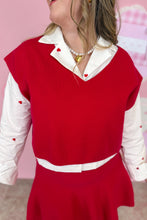 Load image into Gallery viewer, Person wearing a red skirt set with white collar and sleeves against a pink background