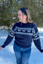 Load image into Gallery viewer, Navy Blue Sweater with Bows and Hearts close up view with arms out
