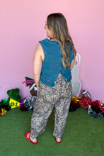 Load image into Gallery viewer, Girl wearing a denim braided tank with leopard barrel jeans standing in front of a pink game day backdrop.
