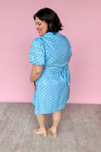 Load image into Gallery viewer, Woman wearing a blue dress with a pink background
