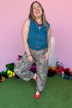 Load image into Gallery viewer, Girl wearing denim top and leopard barrel jeans with red jelly shoes. 
