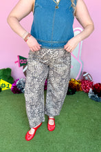 Load image into Gallery viewer, Girl wearing denim top and leopard barrel jeans with red jelly shoes. 
