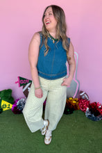 Load image into Gallery viewer, Girl wearing denim top and green polka dot barrel jeans.
