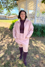 Load image into Gallery viewer, Girl wearing a faux pink leather jacket and skort set with brown undershirt and brown knee high boots standing in front of a gazebo. 
