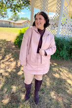 Load image into Gallery viewer, Girl wearing a faux pink leather jacket and skort set with brown undershirt and brown knee high boots standing in front of a gazebo. 
