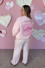 Load image into Gallery viewer, Girl in a pink sweatshirt that says I’m Literally Just a Girl on a guest check and pink knit pants standing in front of a pink heart wall back view
