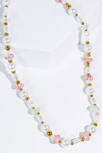 Load image into Gallery viewer, Necklace with pearls, gold beads, and pink floral beads on a white background

