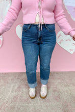 Load image into Gallery viewer, Person wearing blue jeans, and pink shoes on a pink background

