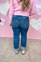 Load image into Gallery viewer, Person wearing a pink sweater and blue jeans standing against a pink wall with heart decorations back view 
